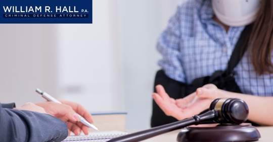 injured woman talking to a lawyer